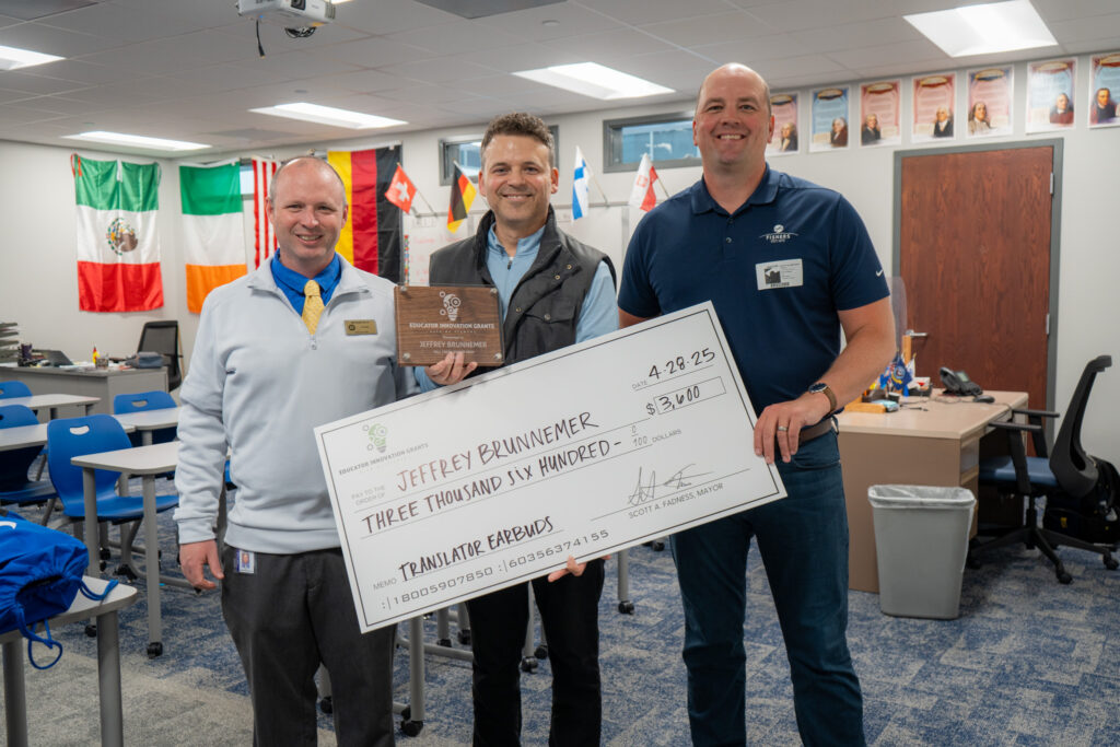 teachergrant2025_-06 jeffrey brunnemer holding check with mayor fadness and principal