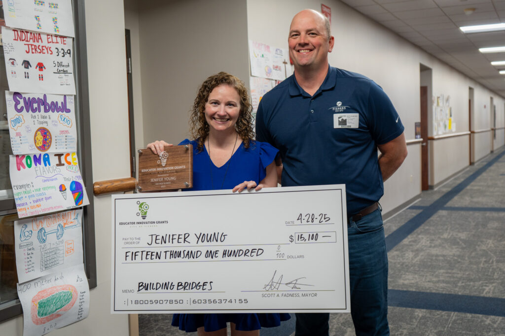 teachergrant2025_-11 jennifer young holding check with mayor fadness