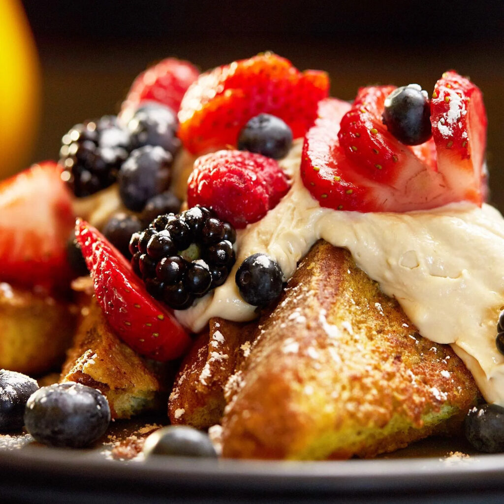 mornings french toast with berries and whip cream