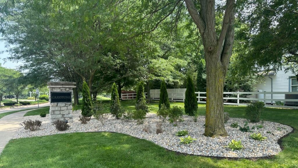 landscaping surrounded by trees